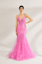 A woman stands against a light background, wearing a pink tulle - and - lace mermaid gown. It has thin straps, a deep V - neckline, and intricate floral lace patterns. The flowing tulle skirt adds romance, combining elegance and charm, perfect for formal events like weddings or galas.1