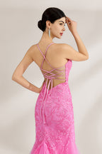 A woman stands against a light background, wearing a pink tulle - and - lace mermaid gown. It has thin straps, a deep V - neckline, and intricate floral lace patterns. The flowing tulle skirt adds romance, combining elegance and charm, perfect for formal events like weddings or galas.6