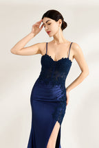 Presented against a light backdrop is a woman donning a navy - blue satin gown. It has thin straps, a sweetheart neckline adorned with lace embroidery, a draped bodice, and a high side slit. The elegant design gives off a glamorous aura, ideal for formal events such as galas or red - carpet affairs.3