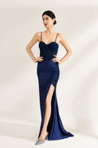 Presented against a light backdrop is a woman donning a navy - blue satin gown. It has thin straps, a sweetheart neckline adorned with lace embroidery, a draped bodice, and a high side slit. The elegant design gives off a glamorous aura, ideal for formal events such as galas or red - carpet affairs.4