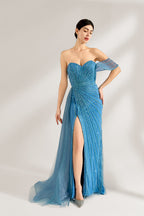 Bathed in soft light, a woman radiates elegance in a blue evening gown. With one - shoulder design, sequin detailing, and a high slit, it crafts a glamorous and sophisticated look for formal events.1