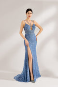 Bathed in soft light, a woman stuns in a blue mermaid - cut gown. It has thin criss - cross straps, a deep V - neckline, and is covered with intricate sequin embroidery, plus a high side slit. The shimmering details lend an air of opulence, perfect for grand galas or red - carpet moments.1