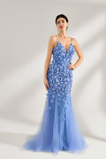 A woman stands against a light background, wearing a light - blue tulle gown. It features thin straps, a deep V - neckline, intricate 3D floral appliqués with sequins on the bodice and skirt, and a mermaid silhouette with a trailing tulle skirt. The elegant design creates a romantic and glamorous look, perfect for formal events like proms or weddings.1
