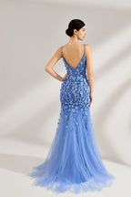 A woman stands against a light background, wearing a light - blue tulle gown. It features thin straps, a deep V - neckline, intricate 3D floral appliqués with sequins on the bodice and skirt, and a mermaid silhouette with a trailing tulle skirt. The elegant design creates a romantic and glamorous look, perfect for formal events like proms or weddings.2