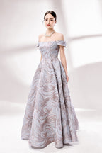 Set against a light backdrop, a woman dons an off - shoulder, light - purple gown with a marble - like pattern. It has short sleeves, a fitted bodice, and a full skirt, along with pockets for practicality. The unique pattern and elegant design make it ideal for formal gatherings, radiating sophistication.4