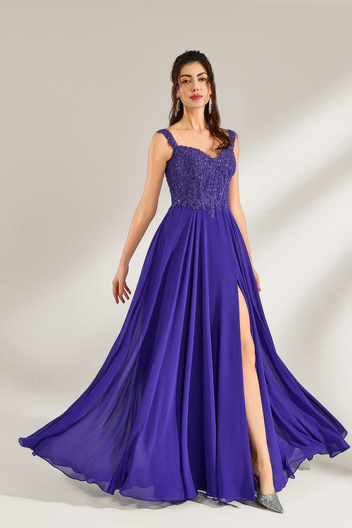 Against a light backdrop, a woman is seen in a purple chiffon gown. It comes with wide straps, a sweetheart neckline, and the bodice is decorated with intricate lace embroidery. There's also a high side slit, and the flowing chiffon skirt gives an elegant and graceful appearance, ideal for formal events such as proms or weddings.1