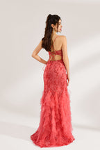 A woman stands against a light background, wearing a coral - pink tulle and lace mermaid gown. It features thin straps, a deep V - neckline with lace - up details, and intricate floral embroidery. The layered, ruffled tulle skirt creates a romantic and glamorous look, perfect for formal events like proms or weddings.2