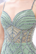 A mannequin presents a pink tulle gown with silver sequin embroidery against a light backdrop. It boasts thin straps, a sheer bodice with geometric patterns, and a mermaid - style skirt. The shimmering sequins and intricate design make it a standout choice for proms or formal events.3