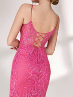 A woman stands against a light background, wearing a bright pink mermaid - style evening gown. It features thin spaghetti straps, a sweetheart neckline, and is covered in shimmering sequins with a sheer, embellished bodice detail. The elegant and glamorous design is perfect for formal events.7