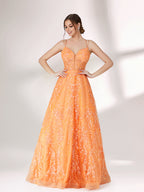A woman stands against a light background, wearing an orange evening gown. It has thin spaghetti straps, a deep V - neckline, and is adorned with delicate floral - like sequin embroidery all over. The voluminous tulle skirt creates an elegant and glamorous look, perfect for formal events.4