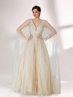 Against a light - hued background, a woman wears an ivory sequin gown with a sheer cape. It features a deep V - neckline, a fitted bodice, and a voluminous skirt. The shimmering sequins and elegant cape design radiate sophistication, perfect for formal events like charity balls, exuding a regal1