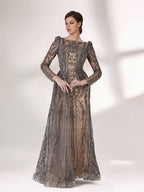 Under subtle lighting, a woman exudes elegance in a long - sleeved evening gown. The gown features a bateau neckline, intricate beadwork and lace patterns, creating a sheer - effect that's both sophisticated and alluring. Ideal for high - end formal occasions, it seamlessly combines luxury and grace.1