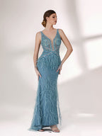 In soft lighting, a woman dazzles in a blue evening gown. With feather details, sequin embellishments, and a mermaid silhouette, it creates a luxurious and eye - catching look for formal events.3