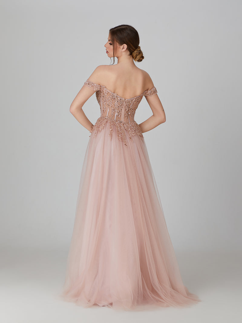 Make a statement at prom with this wholesale Applique Off - Shoulder Tulle Prom Gown. The off - shoulder neckline and sheer bodice showcase intricate floral appliques, paired with a flowing tulle skirt. Perfect for prom nights—blending delicate craftsmanship, airy tulle, and a romantic off - shoulder design to ensure you shine with timeless elegance.