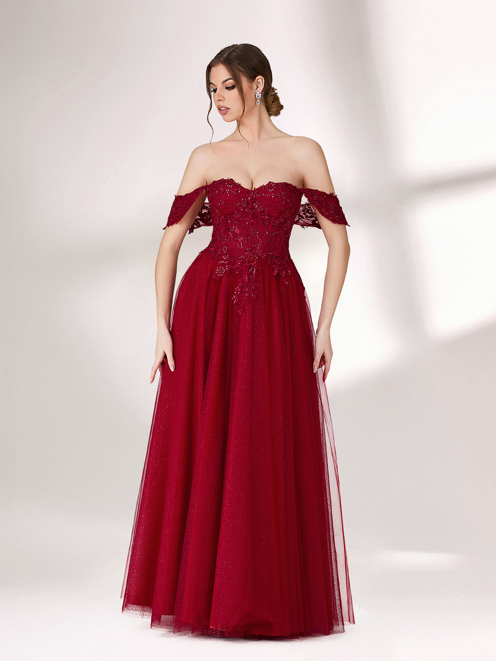 In soft lighting, a woman exudes charm in a burgundy evening gown. With off - shoulder design, lace detailing, and tulle skirt, it creates an elegant and romantic look for formal events.34