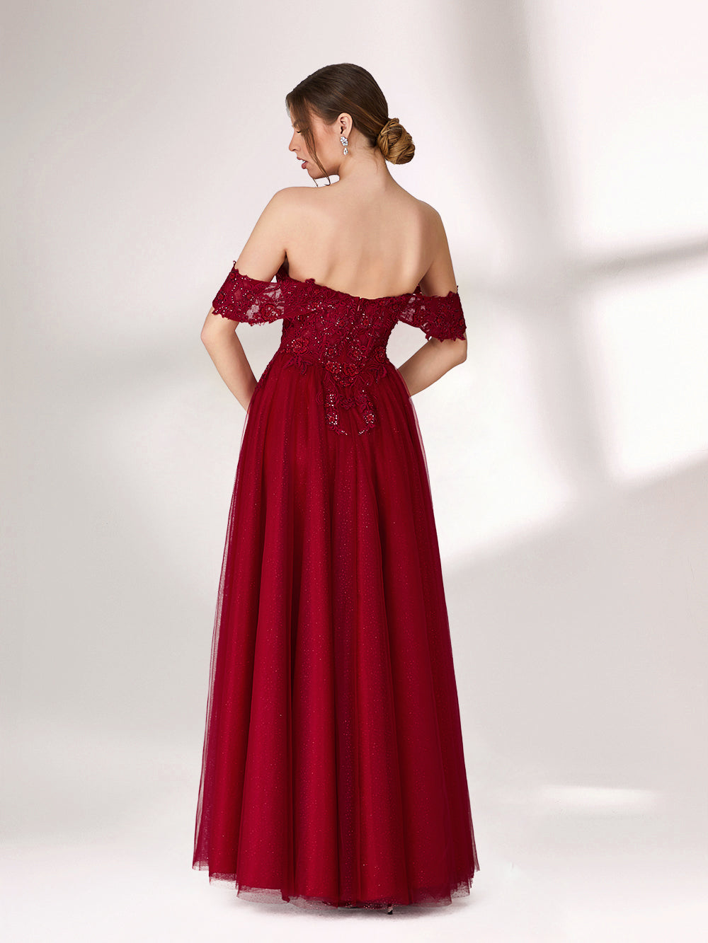 In soft lighting, a woman exudes charm in a burgundy evening gown. With off - shoulder design, lace detailing, and tulle skirt, it creates an elegant and romantic look for formal events.2
