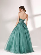 Bathed in soft light, a woman radiates grace in a mint - green evening gown. With floral details, sheer waist, and tulle skirt, it crafts a romantic and elegant look for formal events.2