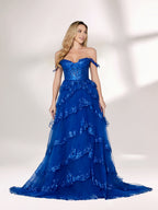 A woman stands against a light background, wearing a royal - blue tulle gown with sequin embellishments. It has an off - shoulder design, a sweetheart neckline, and a tiered skirt. The sparkling sequins and flowing fabric exude romance, perfect for formal events like weddings or galas.4