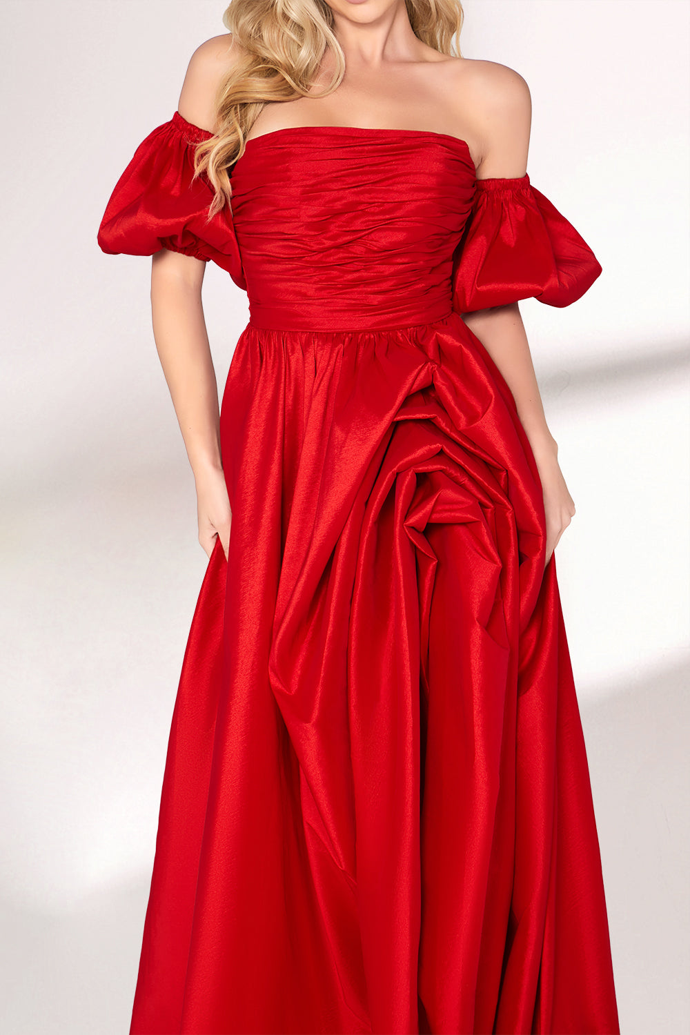 A woman with long, wavy blonde hair and a bright smile wears a vibrant red satin gown. It has thin spaghetti straps, a ruched bodice, and a voluminous, flowing skirt with a subtle train. Paired with simple, light - colored heels, the outfit exudes elegance, perfect for formal events like galas or weddings.03