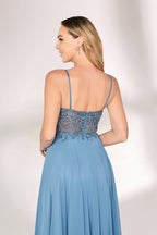 A woman with long, wavy blonde hair and a graceful pose wears a light - blue chiffon gown. It has thin straps, a beaded and lace - detailed bodice, and a flowing, floor - length skirt. Paired with understated heels, the outfit exudes elegance, perfect for formal events like galas or weddings.04