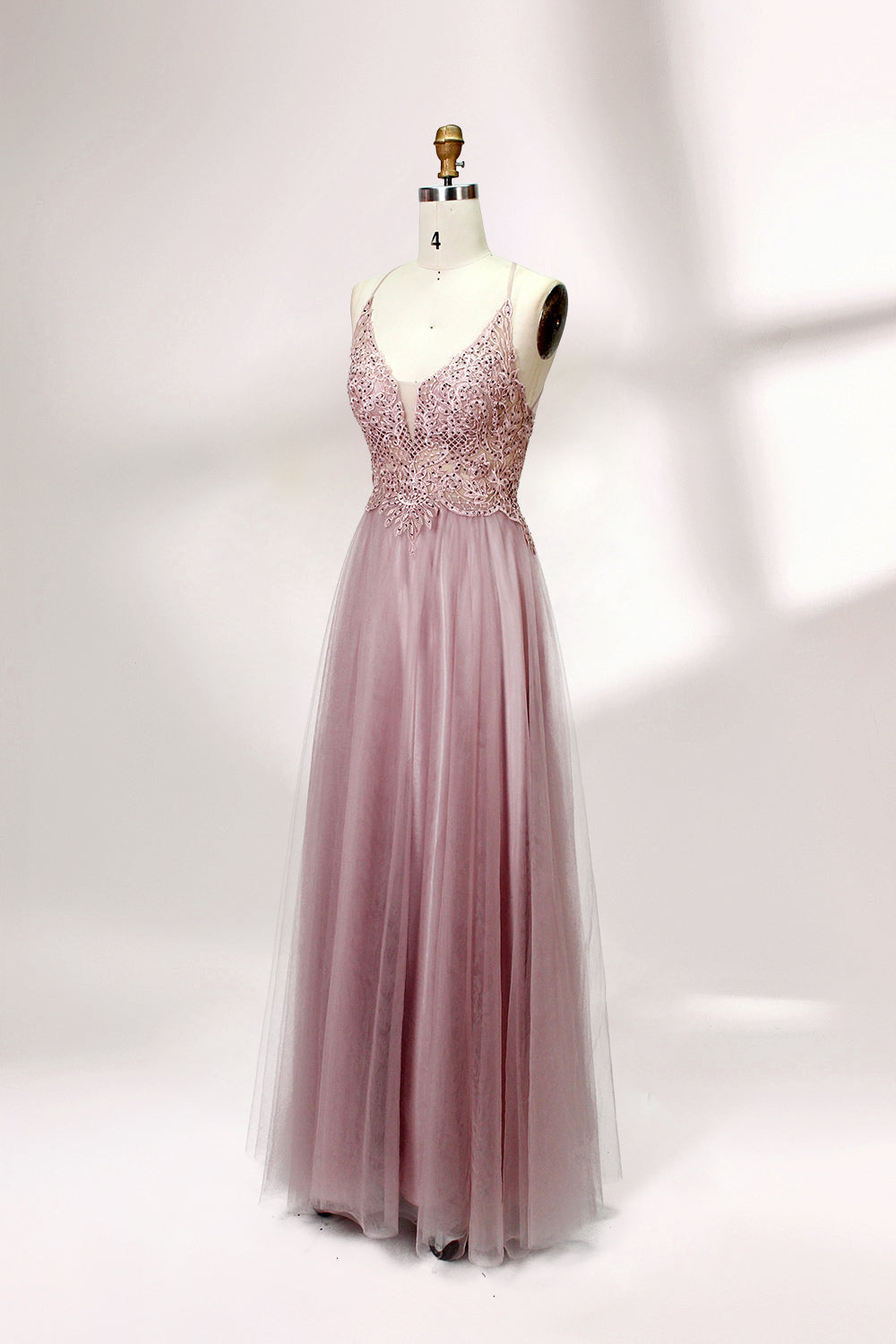 Blush pink tulle prom dress with beaded sheer bodice, V-neck, criss-cross back & flowing skirt. Elegant, dreamy design—perfect for bulk premium partywear stock.03