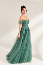 photograph of beautiful woman, elegant off-shoulder green gown, intricate lace details, long flowing tulle skirt, dark curly hair, red lipstick, hands on hips, neutral background, soft lighting, full body shot, fashion photography, classic style, sophisticated, glamorous, high-end fashion, detailed embroidery, smooth fabric texture, poised stance, serene expression, elegant atmosphere.32485c-1b-04