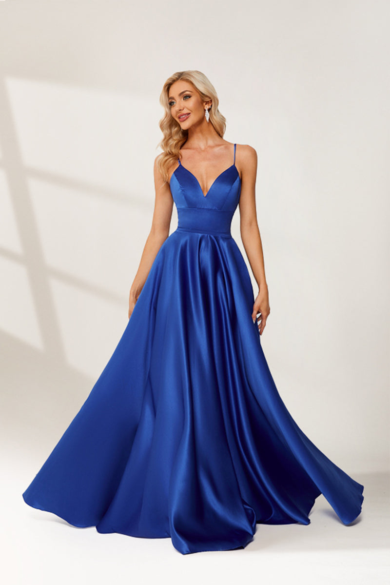 photograph, beautiful woman, long blonde hair, wavy hair, fair skin, blue satin gown, floor-length dress, V-neck, sleeveless, elegant, standing pose, white background, studio lighting, shadows on wall, confident expression, red lipstick, glamorous, high-fashion, evening wear, full body shot, no accessories, simple backdrop, clean lines, minimalistic, modern style, fashionable, chic, sophisticated, elegant, high-quality image, sharp details.32636-03