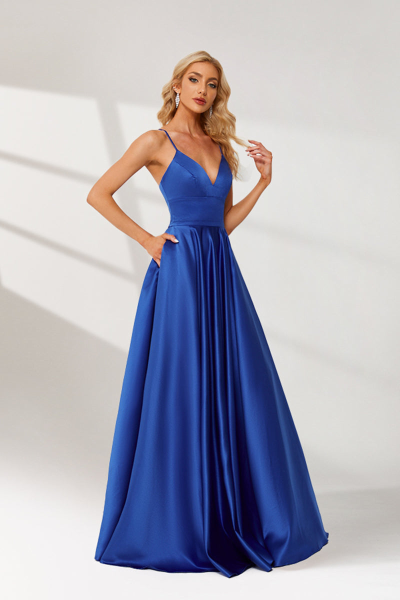 photograph, beautiful woman, long blonde hair, wavy hair, fair skin, blue satin gown, floor-length dress, V-neck, sleeveless, elegant, standing pose, white background, studio lighting, shadows on wall, confident expression, red lipstick, glamorous, high-fashion, evening wear, full body shot, no accessories, simple backdrop, clean lines, minimalistic, modern style, fashionable, chic, sophisticated, elegant, high-quality image, sharp details.32636-07