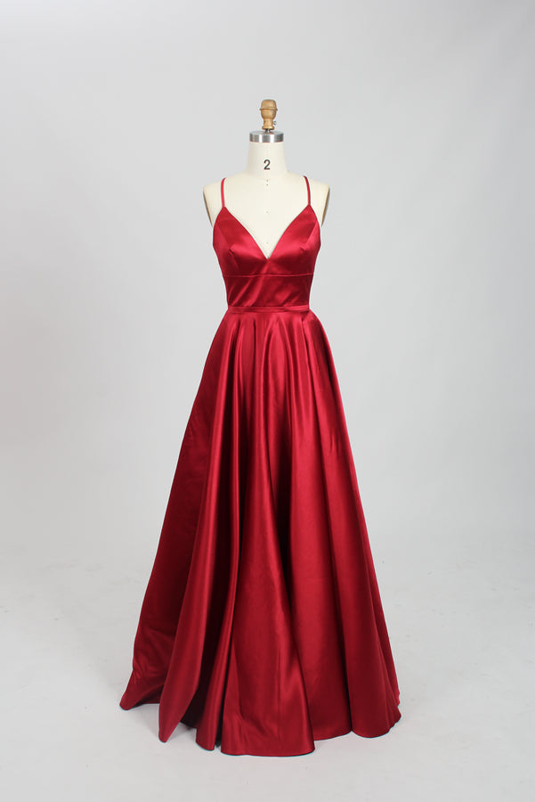 photograph, beautiful woman, long blonde hair, wavy hair, fair skin, blue satin gown, floor-length dress, V-neck, sleeveless, elegant, standing pose, white background, studio lighting, shadows on wall, confident expression, red lipstick, glamorous, high-fashion, evening wear, full body shot, no accessories, simple backdrop, clean lines, minimalistic, modern style, fashionable, chic, sophisticated, elegant, high-quality image, sharp details.32636-11