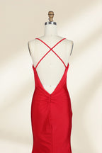 A photograph of a red, floor-length, strapless evening gown displayed on a white dress form with a wooden neck and arm rods. The gown has a fitted bodice and a flowing, slightly flared skirt. The background is a plain, light beige, emphasizing the dress's vibrant color and elegant design.32637.6
