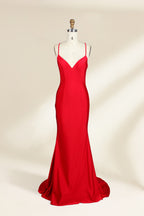 A photograph of a red, floor-length, strapless evening gown displayed on a white dress form with a wooden neck and arm rods. The gown has a fitted bodice and a flowing, slightly flared skirt. The background is a plain, light beige, emphasizing the dress's vibrant color and elegant design.32637_1
