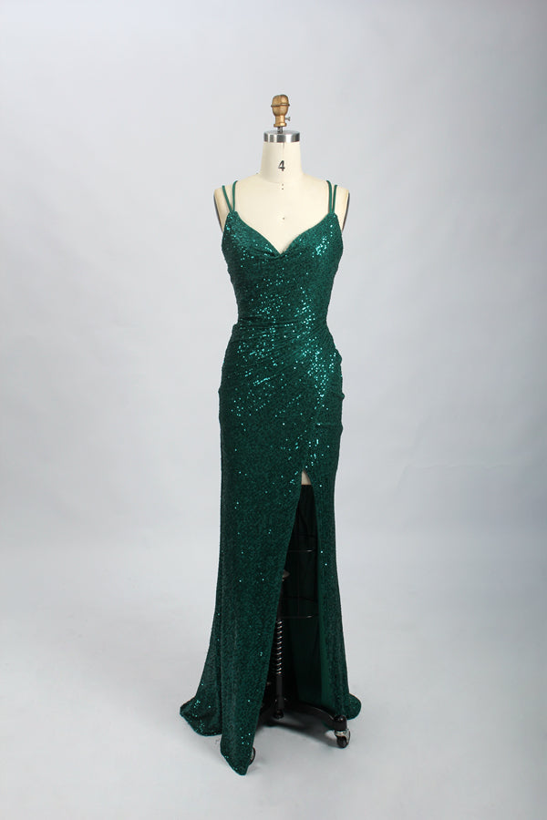 photograph of a dress on a mannequin, elegant dark green sequin gown, deep V-neckline, spaghetti straps, floor-length, slit on one side, black high-heeled shoes, plain light gray background, studio lighting, fashion model, elegant, sophisticated, haute couture, no people, simple setting, high-fashion, luxurious, full-length dress, glamorous, chic, stylish, beautiful, classy, evening wear, formal attire, high-quality fabric, intricate details