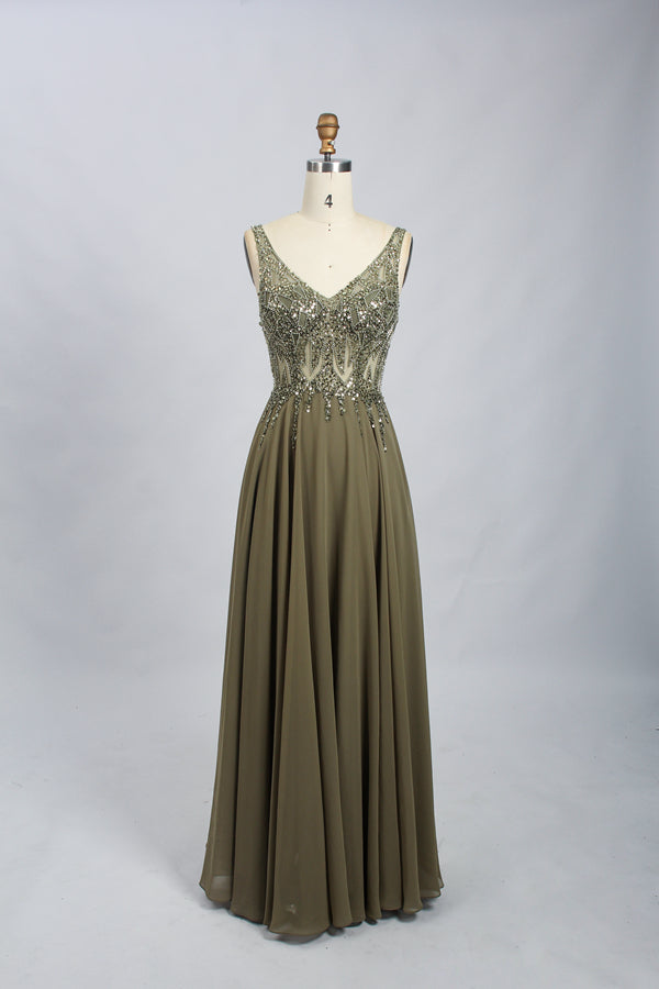photograph of a mannequin wearing an elegant, floor-length, olive green evening gown with intricate beading and sequins on the bodice and shoulders, sleeveless with a deep V-neckline, flowing chiffon skirt, studio setting, plain white background, no other objects or people, fashion photography, detailed texture, luxurious, sophisticated, high-end fashion, full-length view, centered, soft lighting, neutral tones, classic design, haute couture.