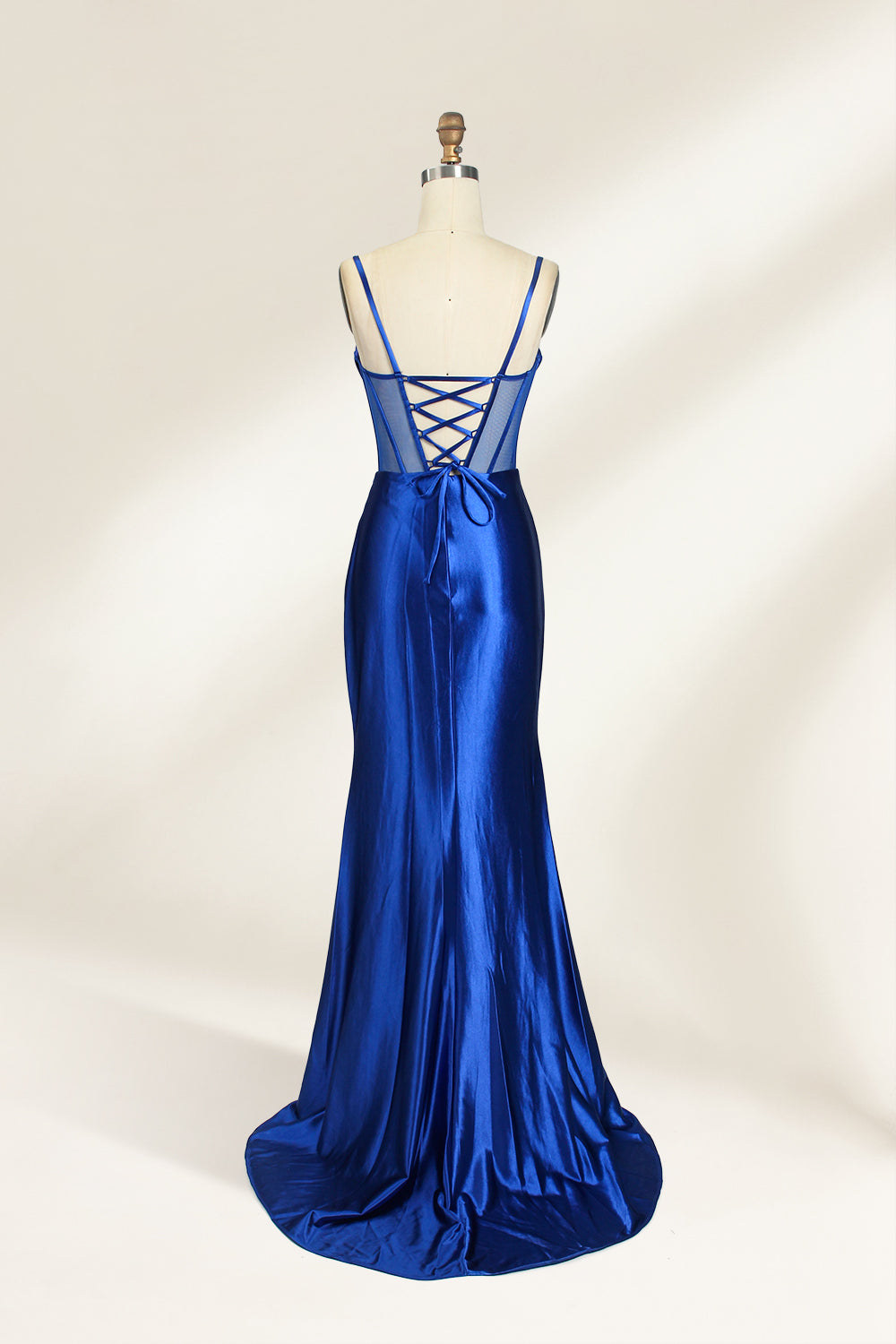 Royal blue satin prom dress with sheer corset bodice, side slit & drape. Luxe, eye-catching design—perfect for bulk orders in premium formal collections.