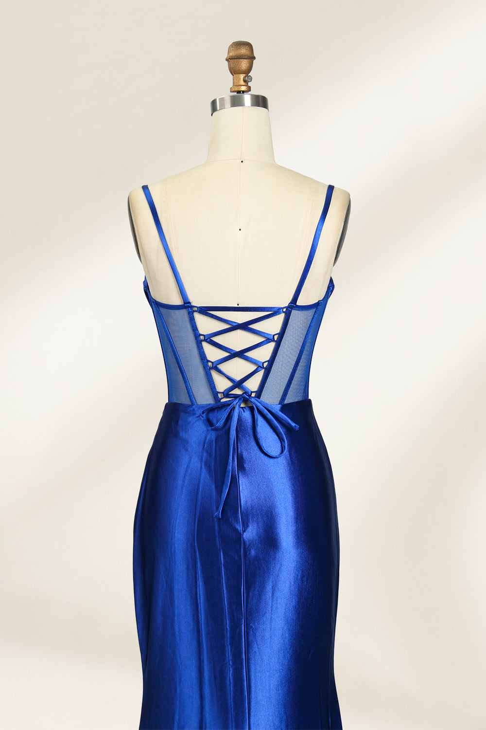 Royal blue satin prom dress with sheer corset bodice, side slit & drape. Luxe, eye-catching design—perfect for bulk orders in premium formal collections. 05