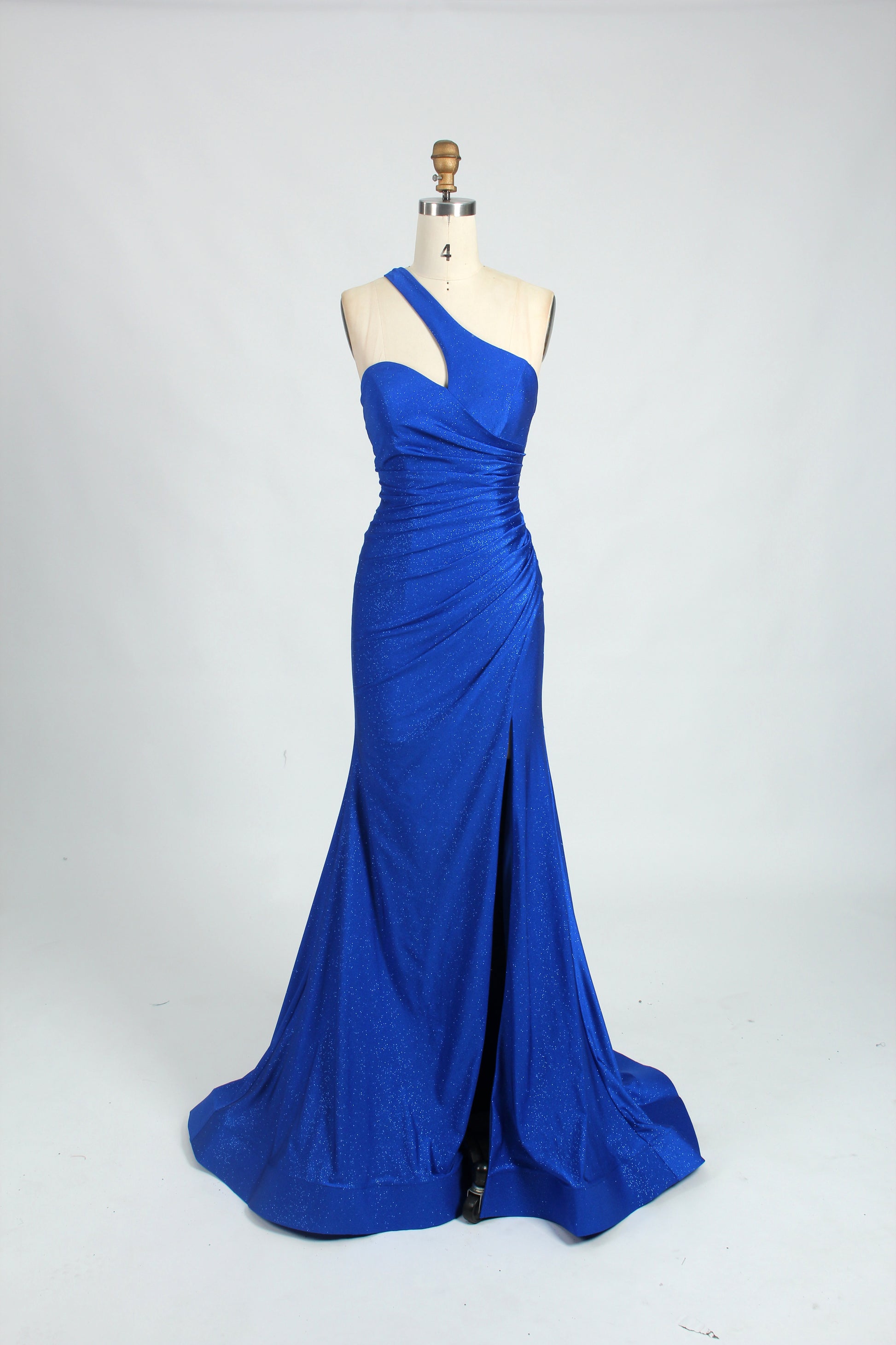 photograph of a mannequin wearing a stunning blue evening gown, floor-length, one-shoulder, elegant, sequined fabric, fitted bodice, flowing skirt, high slit on one side, black platform heels, white background, studio setting, simple and clean, fashion photography, no accessories, no jewelry, no face, no background details, focus on the dress, no people, no text, no watermarks
