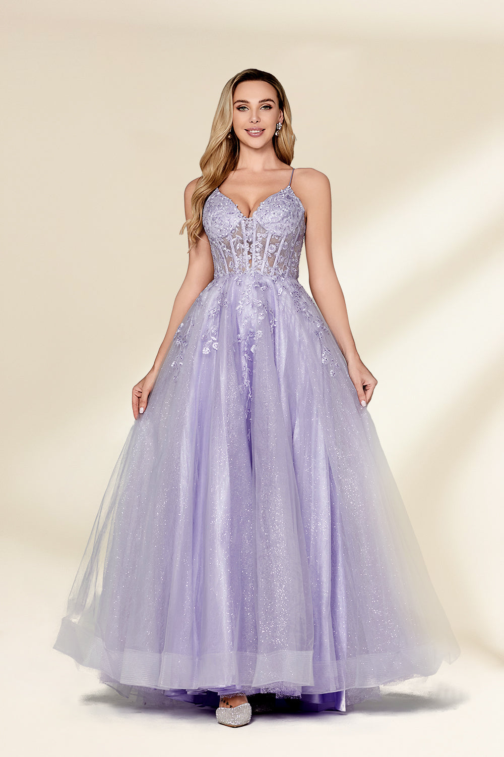 beautiful woman, standing, full-body shot, elegant, long blonde hair, light skin tone, smiling, wearing a sparkly lavender gown, fitted bodice, lace detailing, layered tulle skirt, holding hands, neutral background, studio lighting, soft shadows, formal wear, photograph, fashion, glamorous, high-quality image, dress has a sweetheart neckline, dress has spaghetti straps, dress has a high slit, dress has a train.32814-01