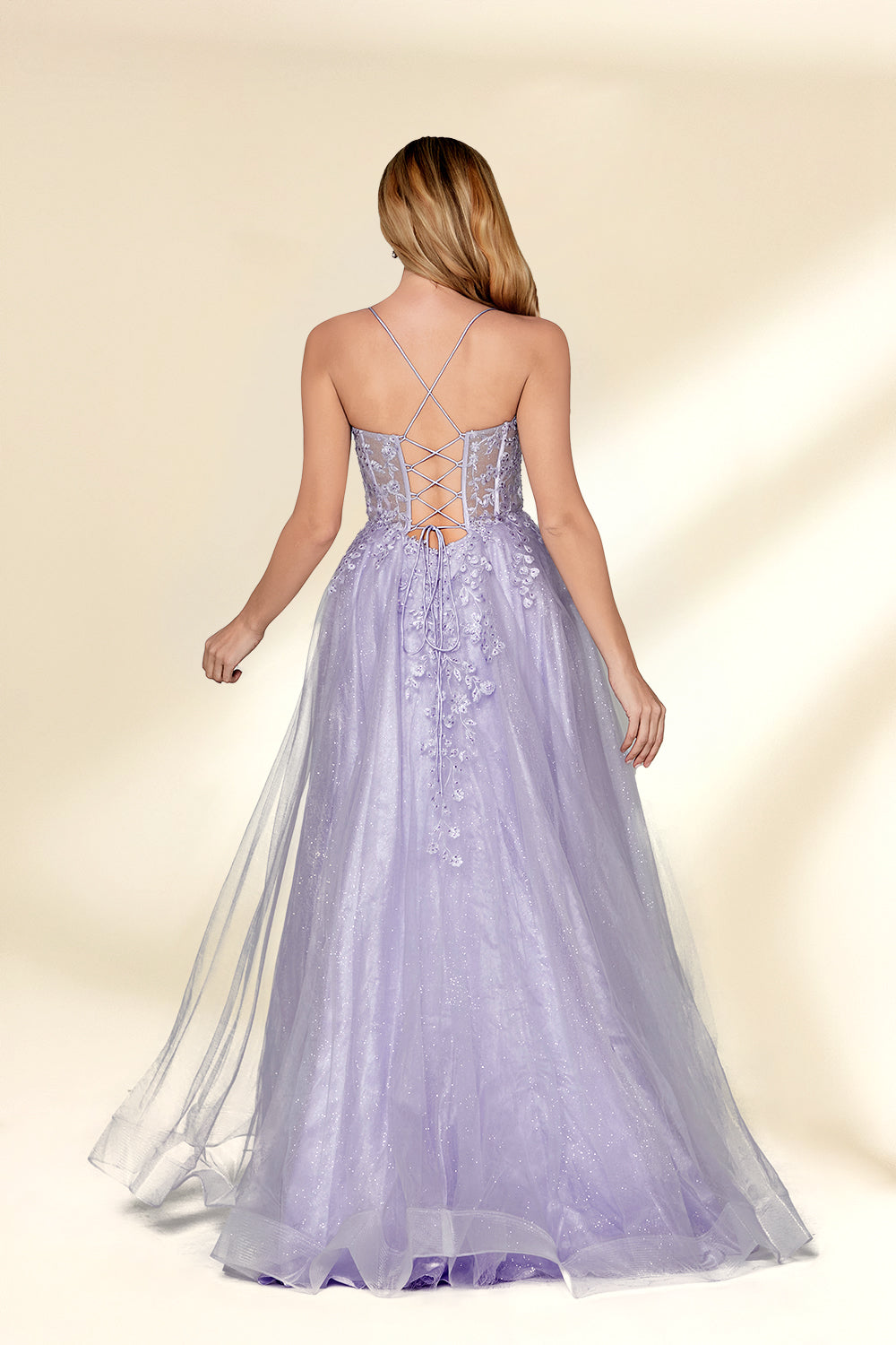 beautiful woman, standing, full-body shot, elegant, long blonde hair, light skin tone, smiling, wearing a sparkly lavender gown, fitted bodice, lace detailing, layered tulle skirt, holding hands, neutral background, studio lighting, soft shadows, formal wear, photograph, fashion, glamorous, high-quality image, dress has a sweetheart neckline, dress has spaghetti straps, dress has a high slit, dress has a train.32814-02