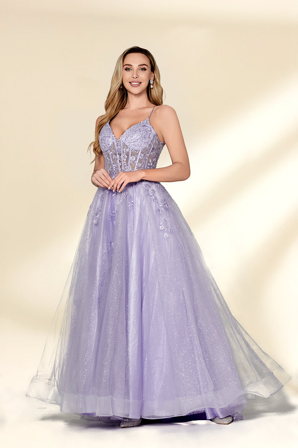beautiful woman, standing, full-body shot, elegant, long blonde hair, light skin tone, smiling, wearing a sparkly lavender gown, fitted bodice, lace detailing, layered tulle skirt, holding hands, neutral background, studio lighting, soft shadows, formal wear, photograph, fashion, glamorous, high-quality image, dress has a sweetheart neckline, dress has spaghetti straps, dress has a high slit, dress has a train.32814-03