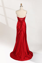 photograph of a mannequin wearing a stunning red ball gown, strapless, lace bodice, flowing satin skirt, thigh-high slit, elegant and classy, white background, soft shadows, mannequin head labeled "6", fashion photography, high fashion, luxurious fabric, detailed lacework, feminine and sophisticated style, no other objects or people, minimalistic setting, clear and sharp image.32978-02