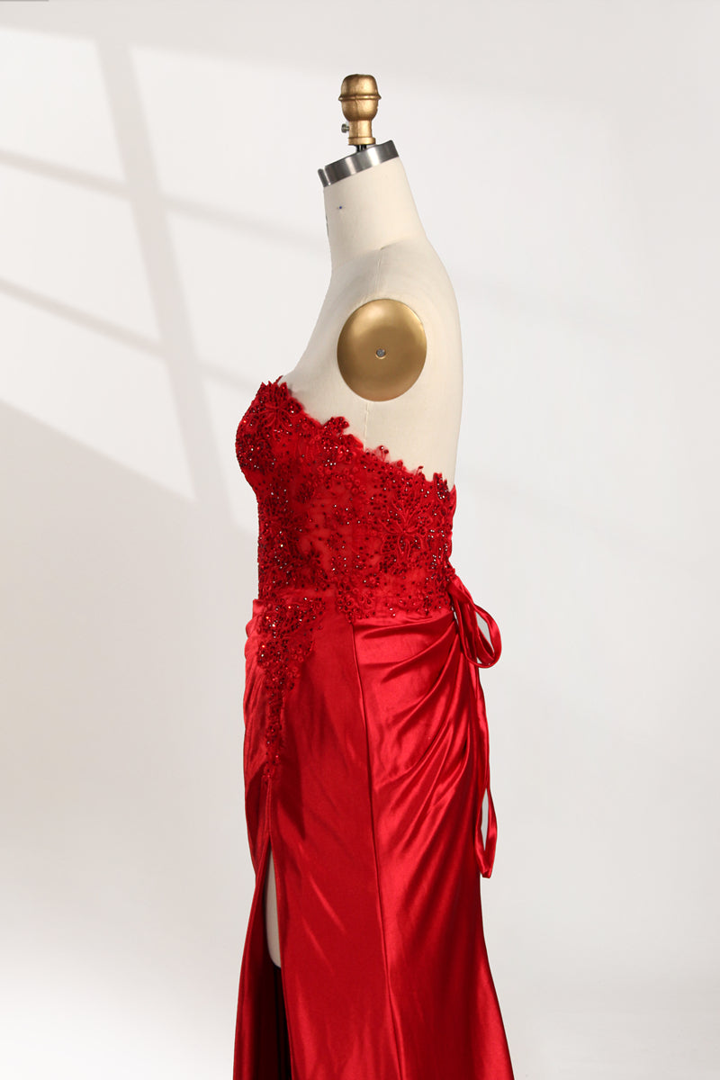 photograph of a mannequin wearing a stunning red ball gown, strapless, lace bodice, flowing satin skirt, thigh-high slit, elegant and classy, white background, soft shadows, mannequin head labeled "6", fashion photography, high fashion, luxurious fabric, detailed lacework, feminine and sophisticated style, no other objects or people, minimalistic setting, clear and sharp image.32978-05