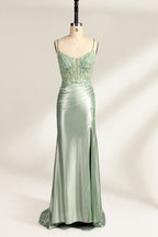 photograph of elegant floor-length evening gown, pastel mint green color, lace bodice with intricate floral patterns, fitted bodice with sweetheart neckline, high slit on right side, smooth satin fabric, model mannequin with neutral expression, studio setting, soft natural lighting, beige background, fashion photography, no accessories, focus on dress details, no people, simple and classy, high-end fashion, luxury, sophistication.33020-01