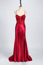 photograph of a beautiful woman wearing a stunning royal blue evening gown with a thigh-high slit, intricate lace detailing on the bodice, elegant design, long sleeves, slim fit, standing in a studio with soft lighting, white background, delicate jewelry, dark hair styled in a sleek updo, confident pose, graceful, sophisticated, fashion photography, high-quality, luxurious, formal attire, glamorous.33028-10