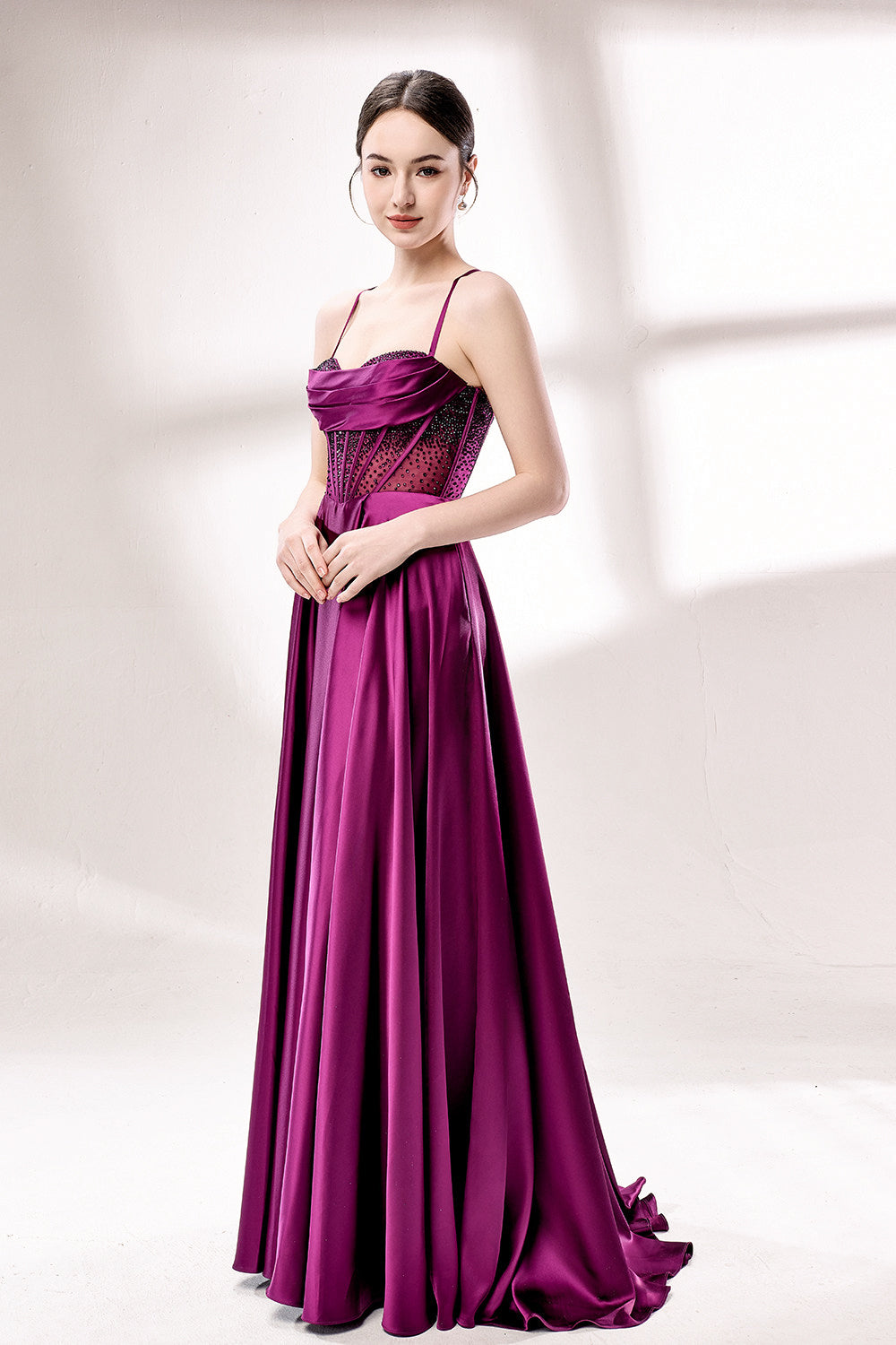 photograph, elegant woman, standing, studio lighting, white background, full-length shot, wearing a floor-length, deep purple satin gown, lace details, spaghetti straps, high slit on one side, hands on hips, brown hair in a sleek updo, red lipstick, soft shadows, minimalistic setting, fashion photography, evening wear, classy, sophisticated, stylish, modern, feminine, confident pose, high-quality image, no visible watermark.33116B-05