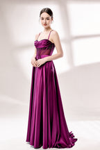 photograph, elegant woman, standing, studio lighting, white background, full-length shot, wearing a floor-length, deep purple satin gown, lace details, spaghetti straps, high slit on one side, hands on hips, brown hair in a sleek updo, red lipstick, soft shadows, minimalistic setting, fashion photography, evening wear, classy, sophisticated, stylish, modern, feminine, confident pose, high-quality image, no visible watermark.33116B-05