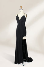 Displayed on a mannequin is a black evening gown. It features spaghetti straps, a deep V - neck, and a high slit with crystal detailing, creating a sleek and glamorous look for formal events.3