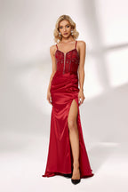A woman stands against a light background, wearing a deep - red satin gown. It features off - shoulder sleeves, a beaded bodice, and a high side slit. The intricate bead patterns and ruched skirt create a glamorous look, perfect for formal events like galas or evening parties, exuding elegance and charm.6