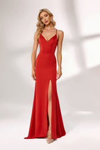 Bathed in soft light, a woman radiates charm in a red evening gown. With spaghetti straps, a deep V - neck, and a thigh - high slit, it crafts an elegant yet alluring look for formal events.3