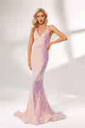 A woman stands against a light background, wearing a pink - purple ombre sequin gown. It features a deep V - neckline, a mermaid silhouette, and a low back. The shimmering sequins create a glamorous effect, perfect for formal events like galas or proms, exuding elegance and charm.1