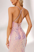 A woman stands against a light background, wearing a pink - purple ombre sequin gown. It features a deep V - neckline, a mermaid silhouette, and a low back. The shimmering sequins create a glamorous effect, perfect for formal events like galas or proms, exuding elegance and charm.4